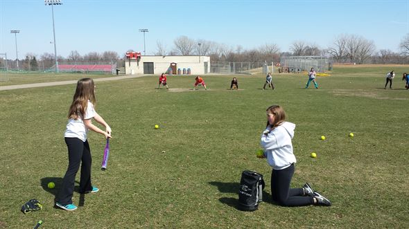 Colleen and Kaylie doing a little soft toss.