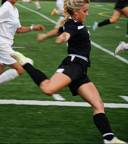 Angie Martin at right forward with a targeted ball through the opponents' defense. (Photo cr. to Michele Cohn)