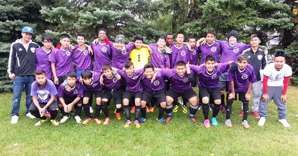 Coaches Tar Baw and Tha Wah and the 2014 "C Gold" Boys' Soccer Team.